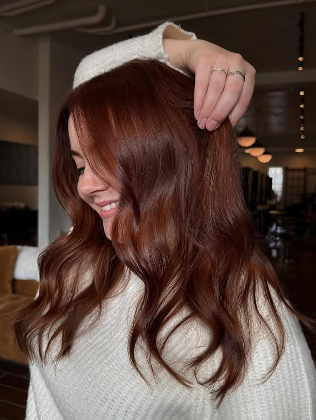 20. Warm Mahogany Auburn Hair with Soft Cascading Waves - Dark Auburn Hair Color