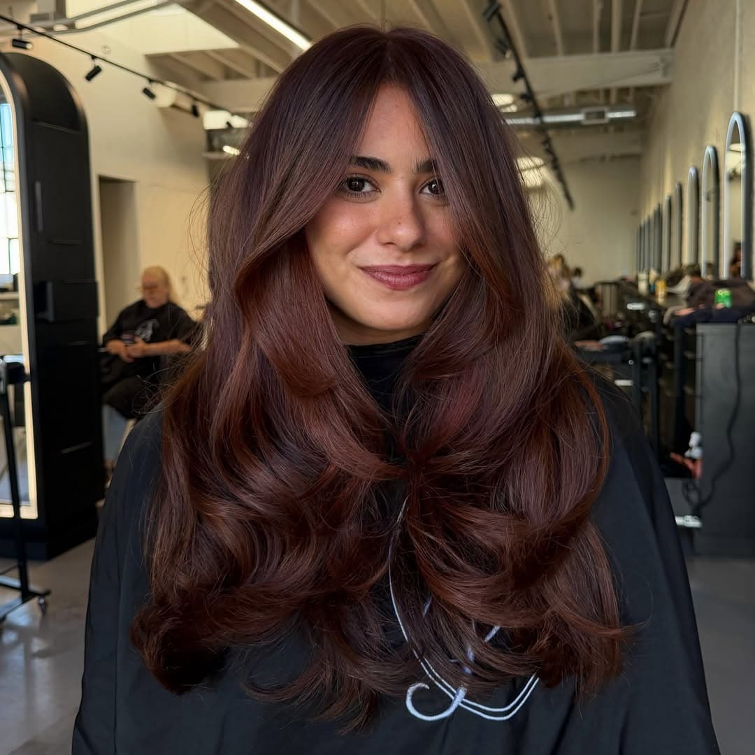 21. Rich Mahogany Auburn Hair with Voluminous Butterfly Layers - Dark Auburn Hair Color