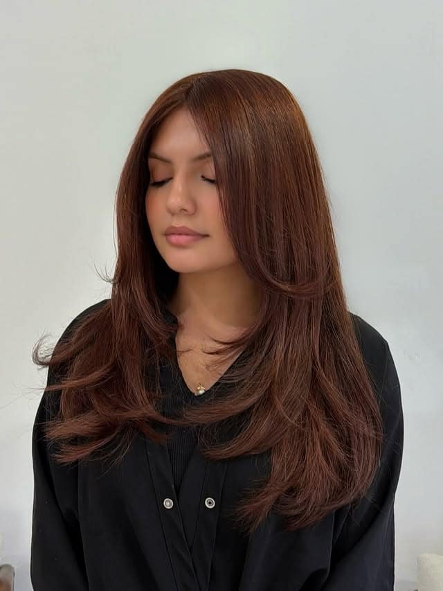 22. Warm Chestnut Auburn Hair with Long Feathered Layers - Dark Auburn Hair Color