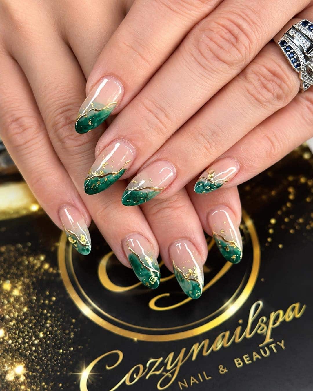 19. Emerald Green Marble French Tip Nails with Gold Foil - green and gold nail ideas