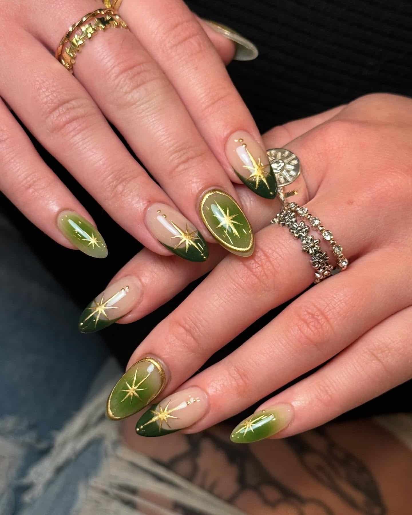 22. Olive Green Almond Nails with Gold Starburst Accents - green and gold nail ideas