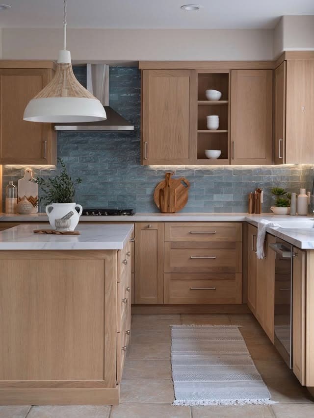 3. Soft Beige Oak Kitchen with Dusty Blue Tile Backsplash - natural kitchen ideas
