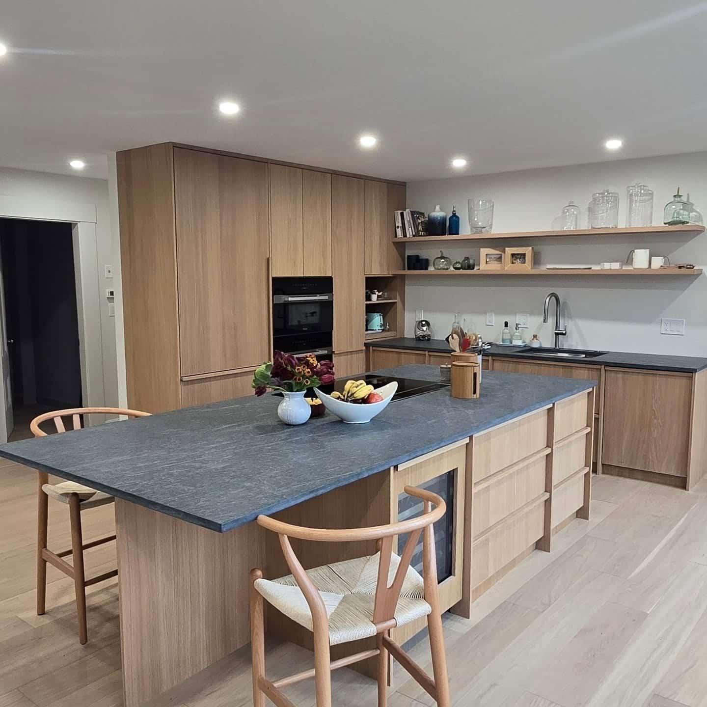 9. Natural Blonde Wood Kitchen with Charcoal Gray Stone Island - natural kitchen ideas
