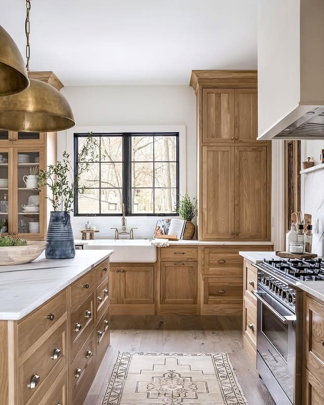 17. Natural Oak Farmhouse Kitchen with White Marble and Black Window Frames - natural kitchen ideas