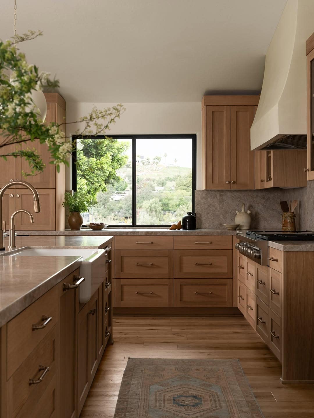 19. Natural Light Oak Kitchen with Soft Gray Stone Backsplash - natural kitchen ideas