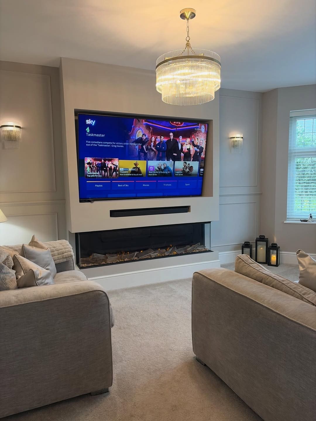 1. Elegant Cream Entertainment Center with Crystal Chandelier - living room entertainment center ideas