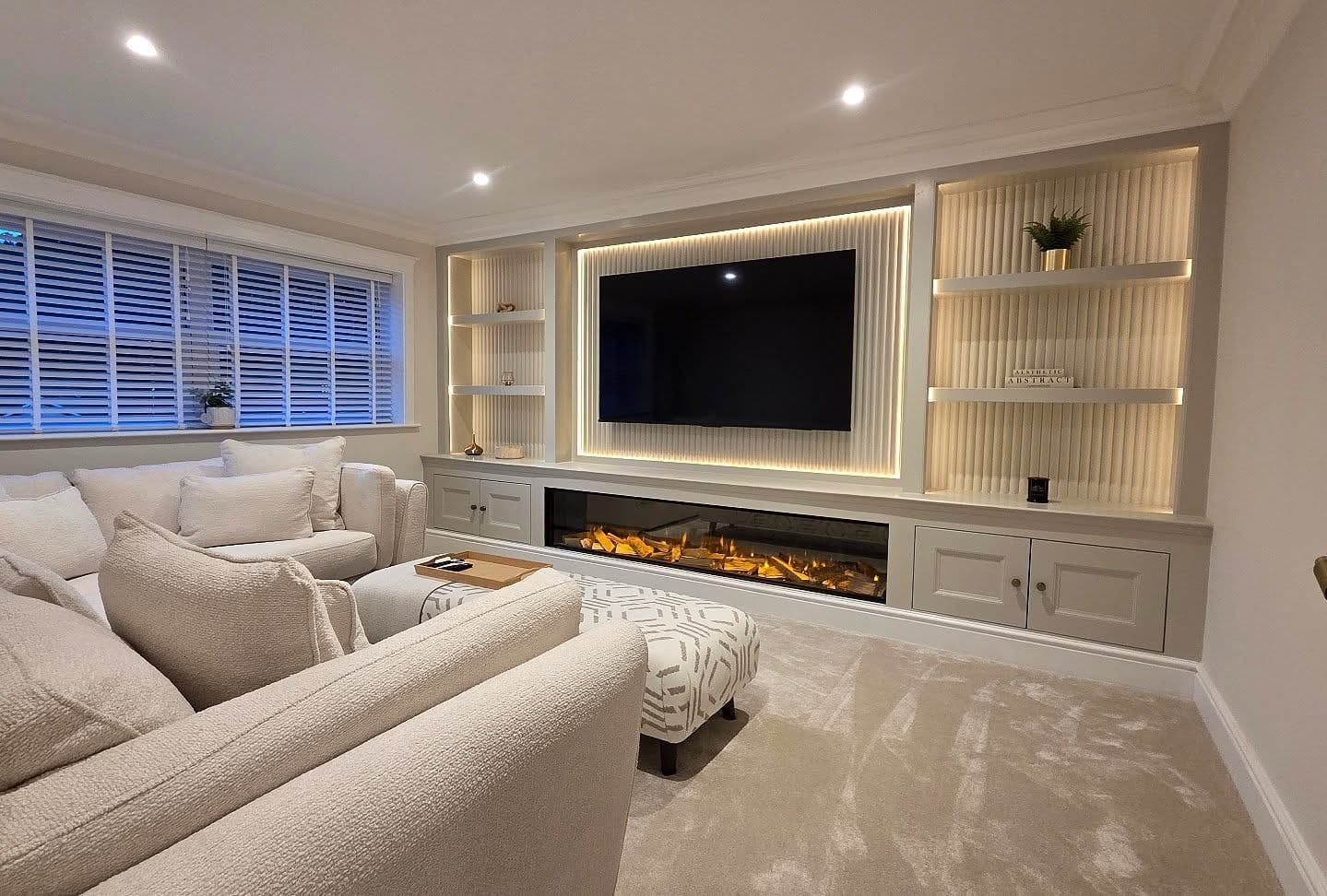 5. Classic White Entertainment Center with Built-In Fireplace - living room entertainment center ideas
