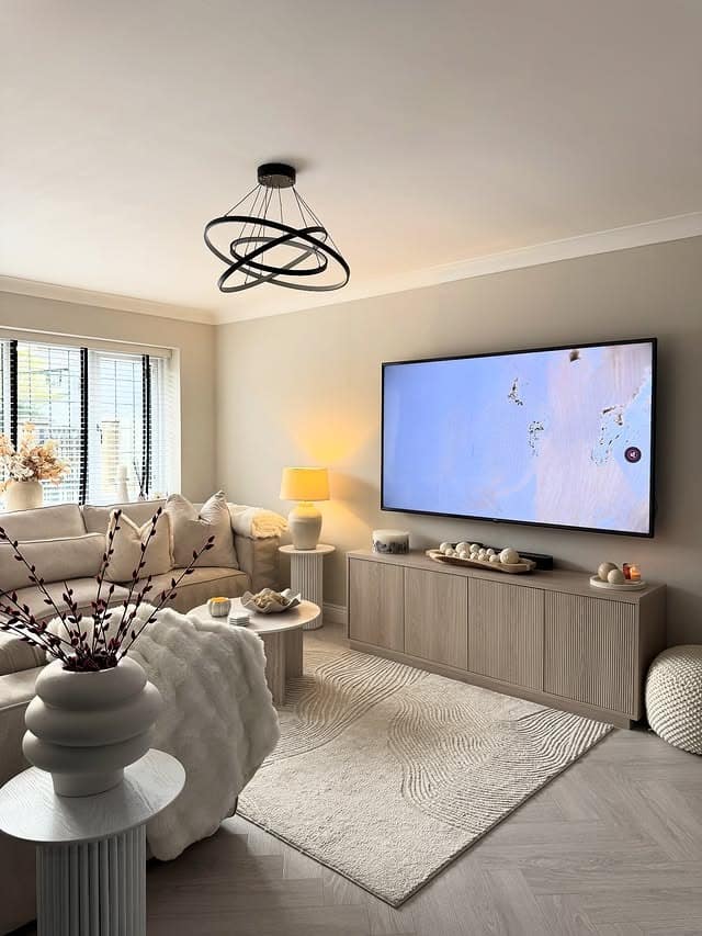 11. Minimalist Beige Entertainment Center with Fluted Cabinet - living room entertainment center ideas