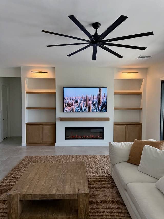 22. Rustic White and Light Brown Entertainment Center with Built-In Fireplace - living room entertainment center ideas