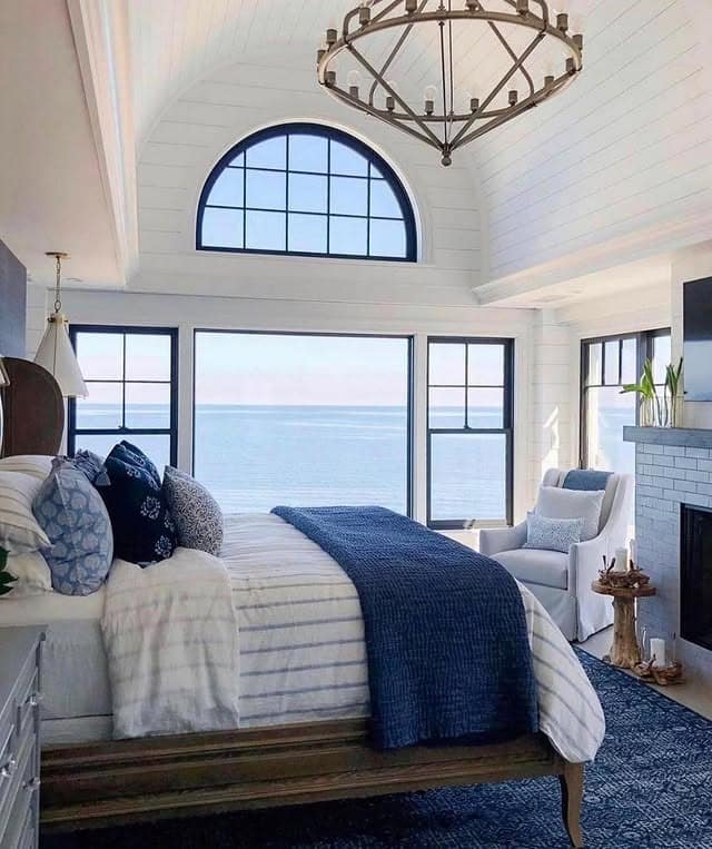 5. Elegant Aqua and Navy Coastal Bedroom with Ocean Views - aqua bedroom ideas