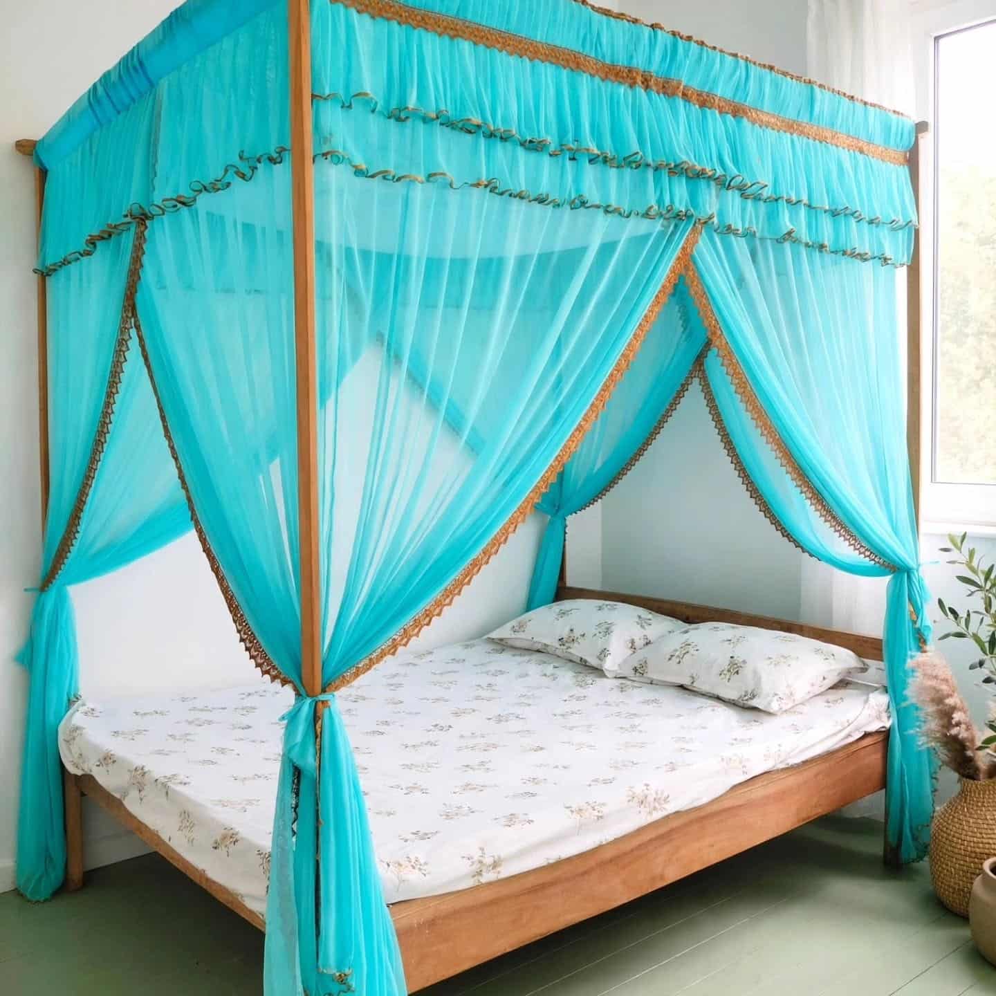 11. Vibrant Aqua and Gold Canopy Bedroom with Sheer Curtains - aqua bedroom ideas