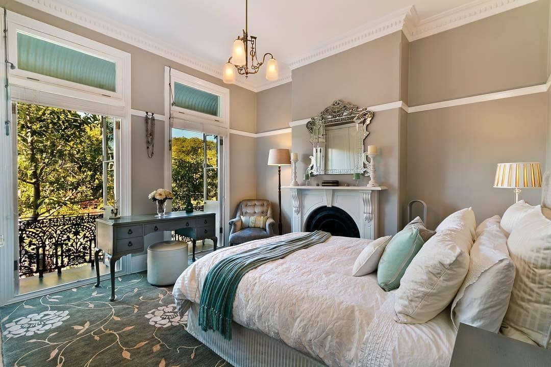 14. Classic Aqua and Taupe Bedroom with Vintage Fireplace - aqua bedroom ideas