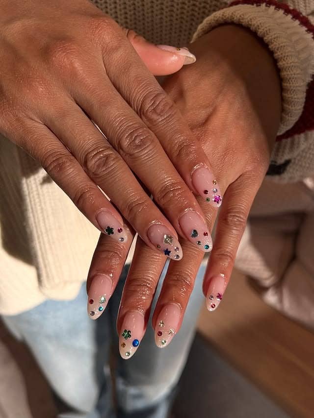 1. Multicolored Floral Gem Nails on a Nude Pink Base - nail ideas with gems