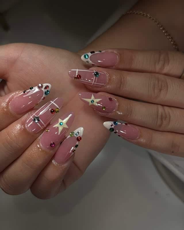 9. Dusty Rose Stiletto Nails with Star and Gem Details - nail ideas with gems