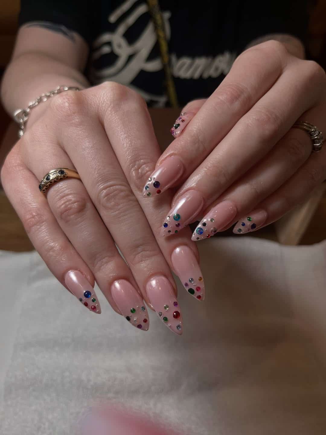 11. Nude Pink Stiletto Nails with Rainbow Gem Tips - nail ideas with gems