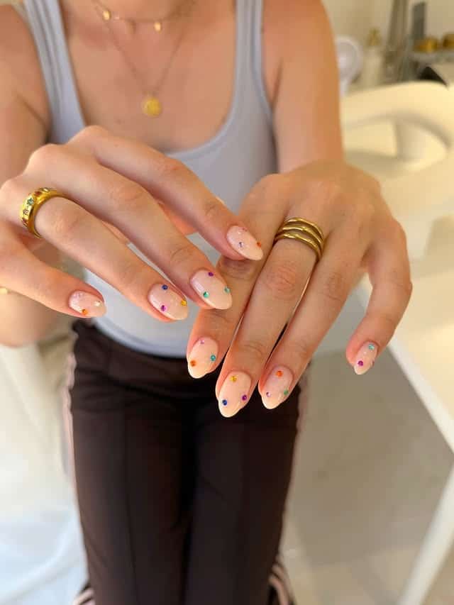 14. Sheer Peach Almond Nails with Colorful Crystal Accents - nail ideas with gems