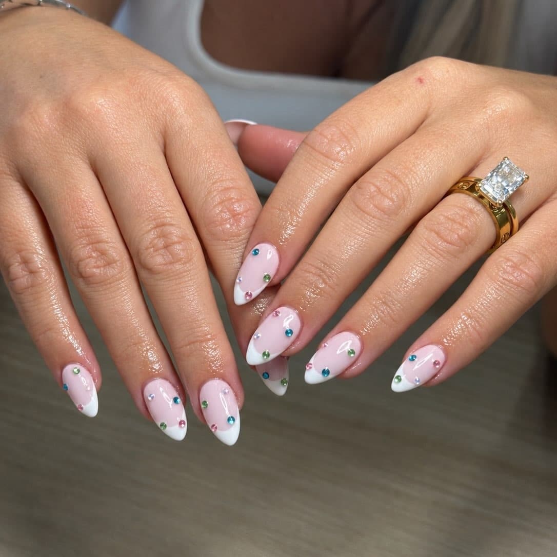 17. Milky Pink Almond French Nails with Rainbow Rhinestones - nail ideas with gems