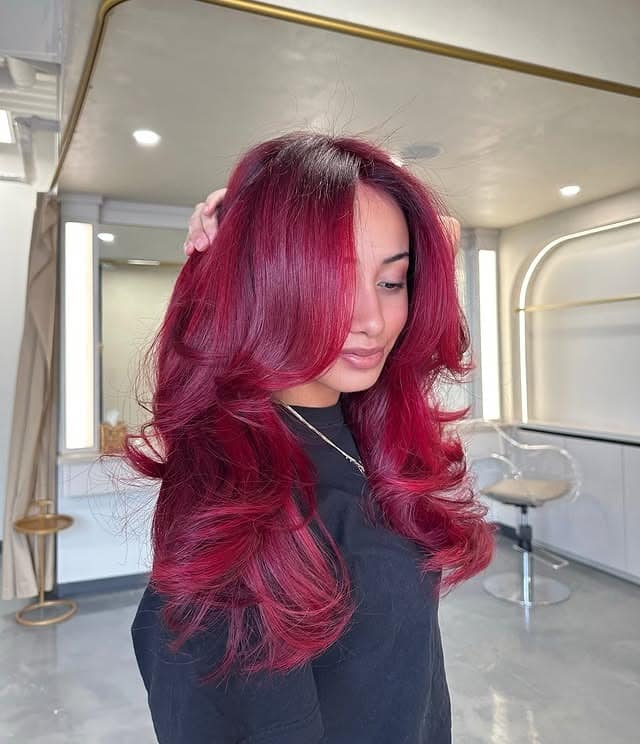 2. Bold Cherry Red Hair with Voluminous Butterfly Layers - Red Hair Color