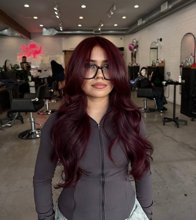 7. Deep Burgundy Red Hair with Flowing Curtain Layers - Red Hair Color