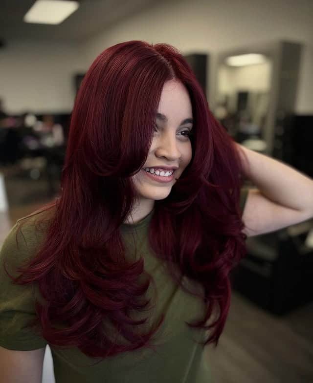 8. Dark Wine Red Hair with Bouncy Butterfly Layers - Red Hair Color