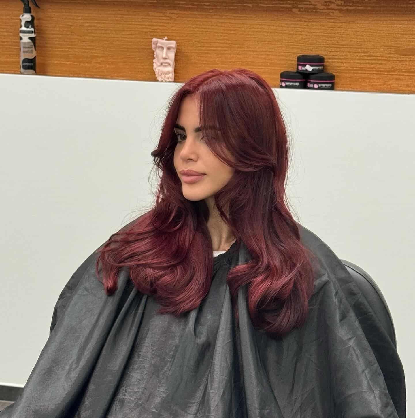 9. Soft Mahogany Red Hair with Shoulder-Length Feathered Layers - Red Hair Color