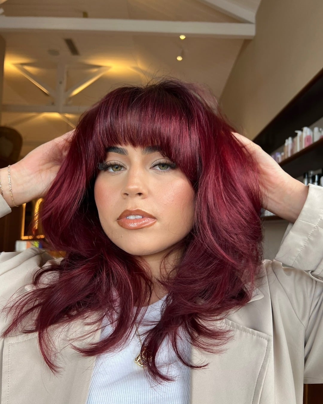 10. Berry Red Hair with Full Bangs and Shaggy Layers - Red Hair Color