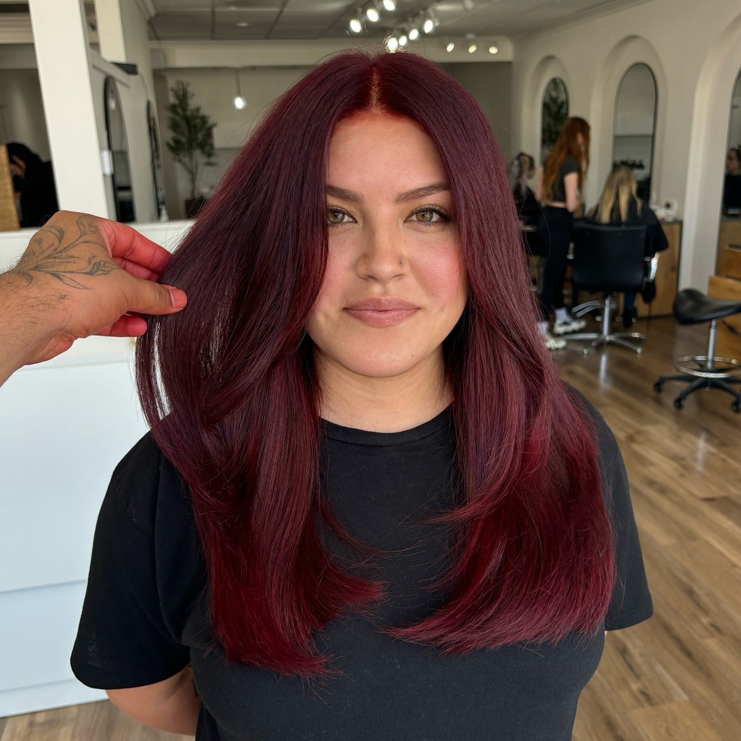 11. Deep Burgundy Red Hair with Sleek Face-Framing Layers - Red Hair Color