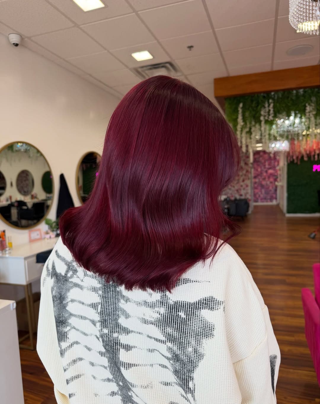 14. Glossy Cherry Burgundy Red Hair with a Sleek Layered Lob - Red Hair Color