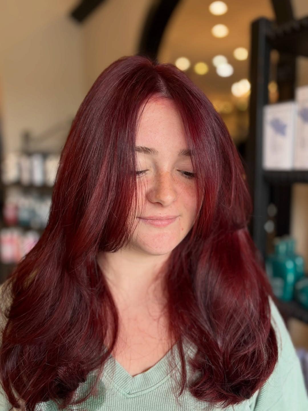 16. Deep Mahogany Red Hair with Soft Curtain Bangs - Red Hair Color