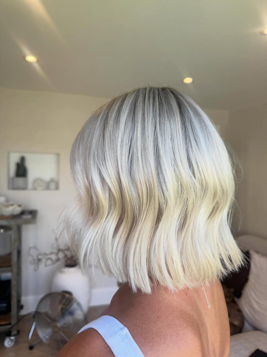 4. Pearl Blonde Blunt Bob with Soft Beach Waves - Short Blonde Hairstyles