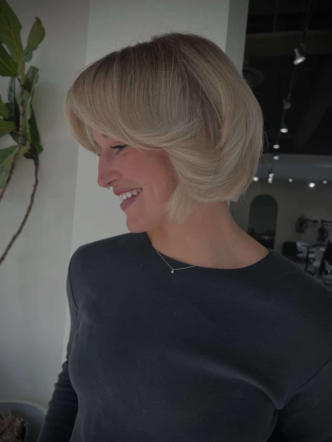 9. Ash Blonde Graduated Bob with Side-Swept Fringe - Short Blonde Hairstyles