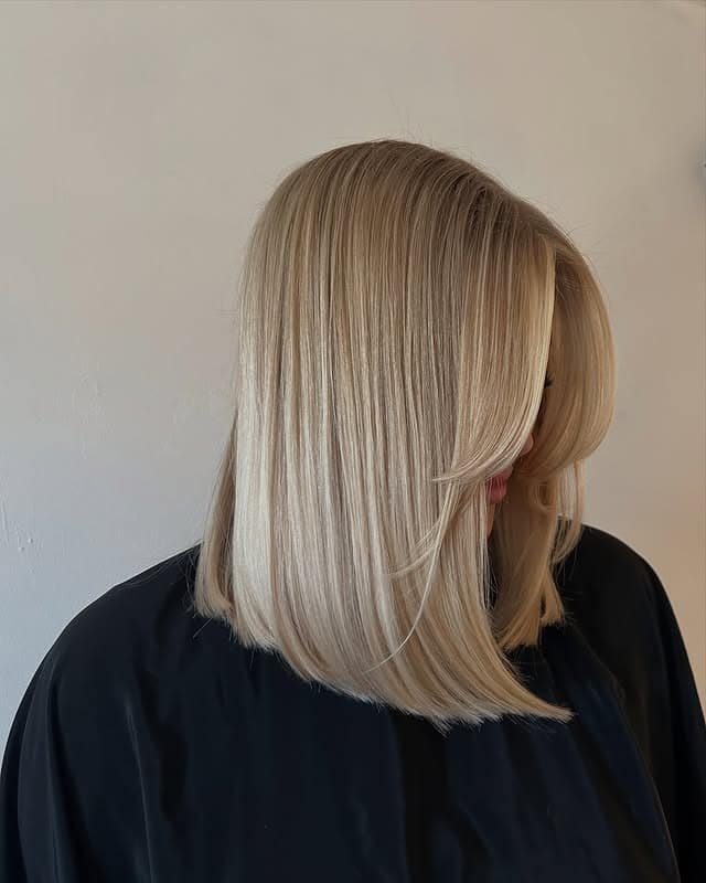 12. Creamy Vanilla Blonde Sleek Lob with Face-Framing Layers - Short Blonde Hairstyles