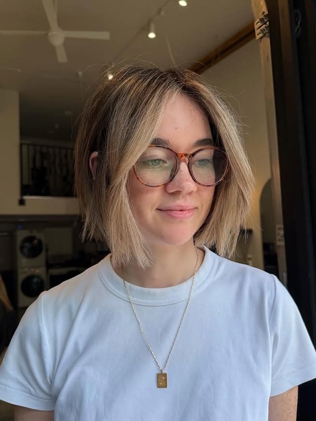 18. Mushroom Blonde French Bob with Soft Curtain Fringe - Short Blonde Hairstyles