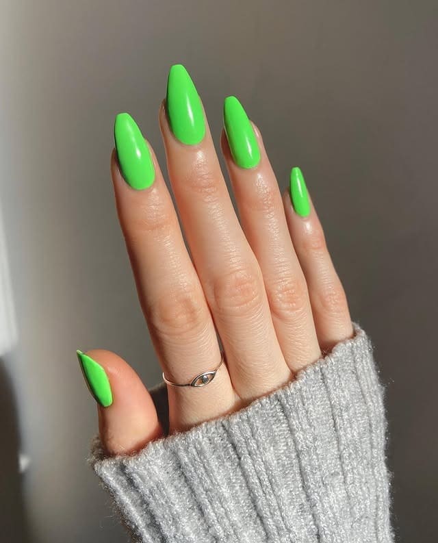 2. Electric Neon Green Long Almond Nails - neon green nail ideas