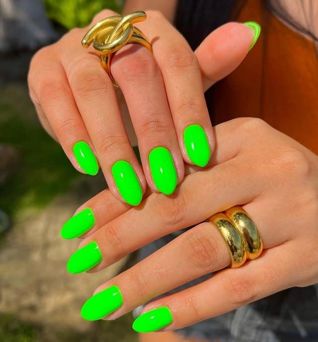 6. Vivid Neon Green Short Oval Nails - neon green nail ideas