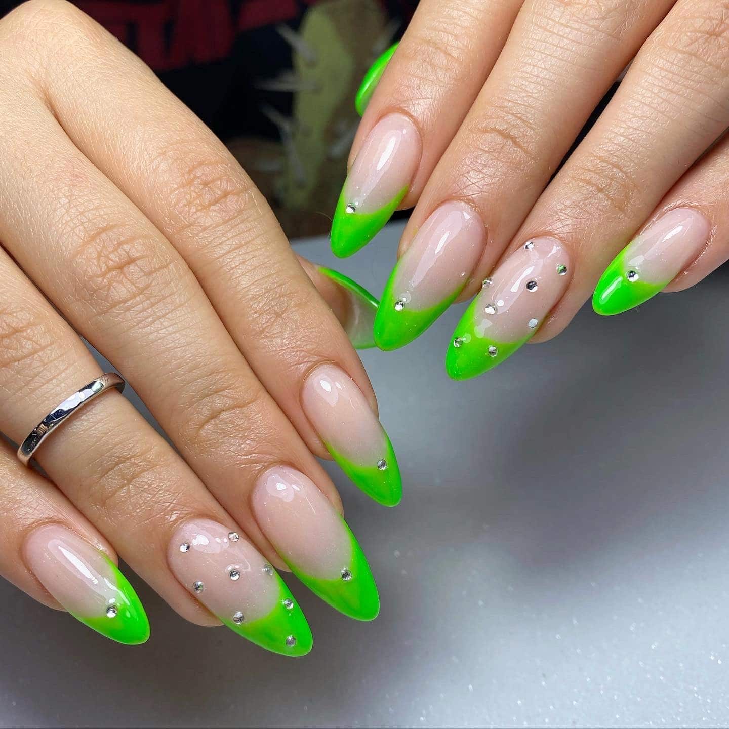 13. Neon Green French Tip Almond Nails with Rhinestones - neon green nail ideas