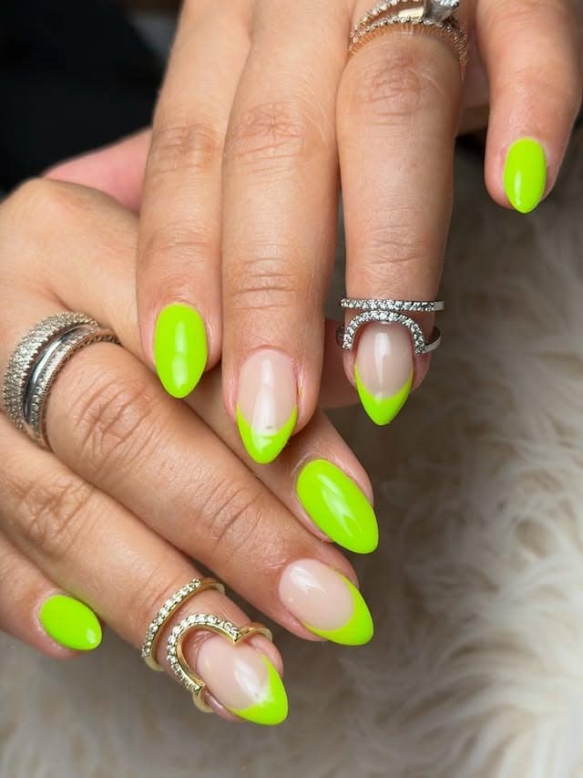 17. Neon Lime Green French Tip and Solid Almond Nails - neon green nail ideas