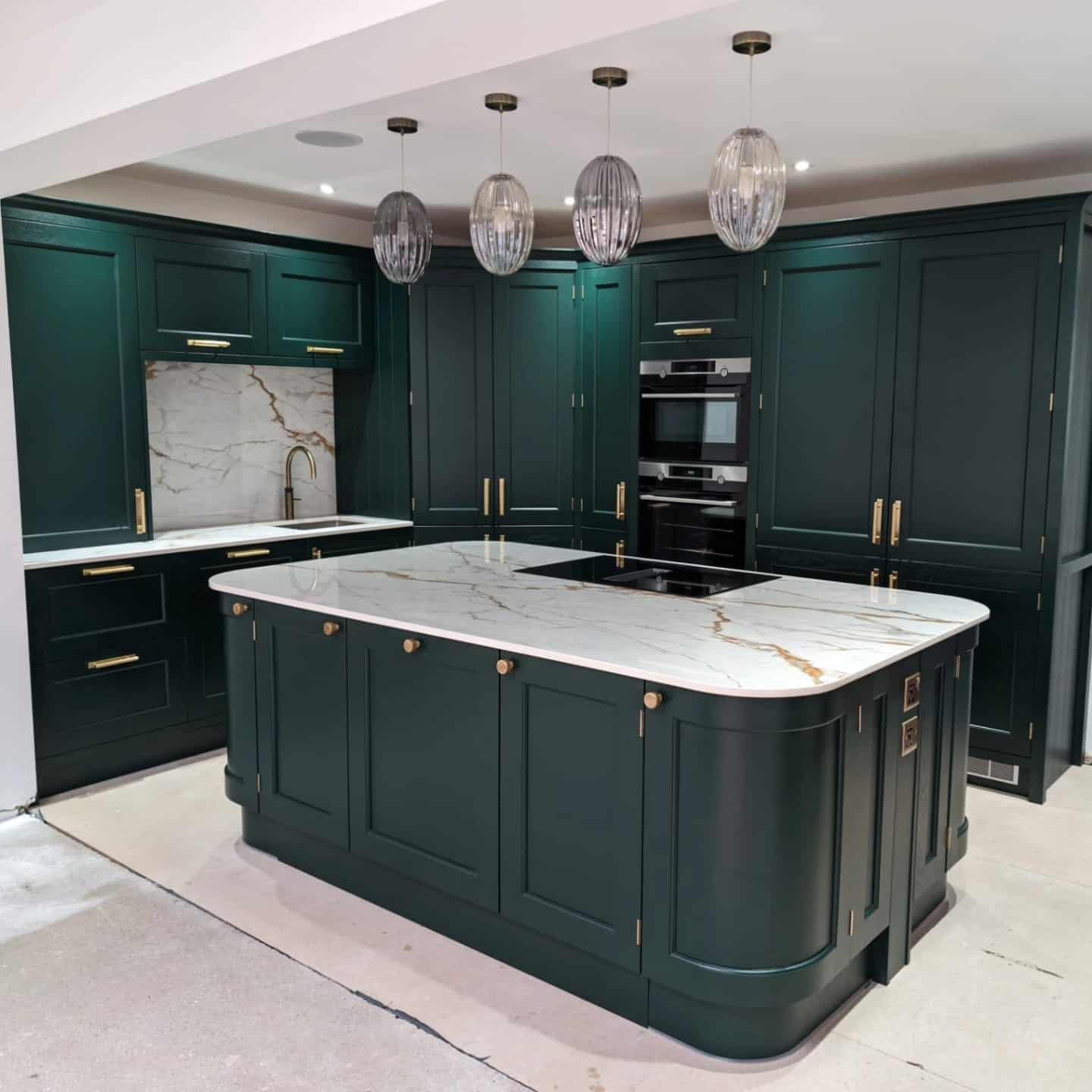 10. Timeless Dark Emerald Green Kitchen with Gold Hardware - emerald green kitchen ideas