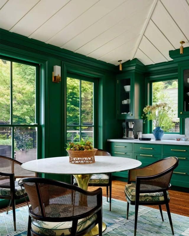11. Vibrant Emerald Green Kitchen with White Dining Table - emerald green kitchen ideas