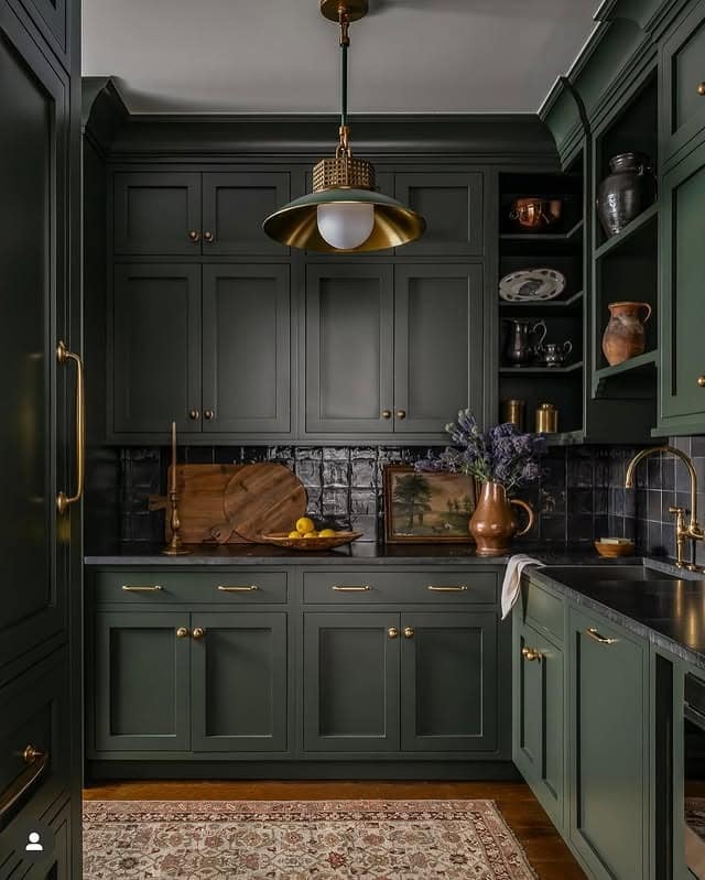 12. Moody Dark Emerald Green Kitchen with Vintage Brass Accents - emerald green kitchen ideas
